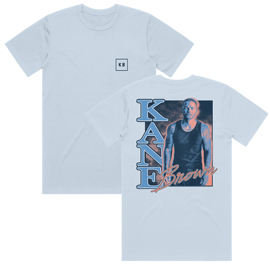 A light blue Kane Brown t-shirt with a photo of Kane Brown on the front and text on the back.